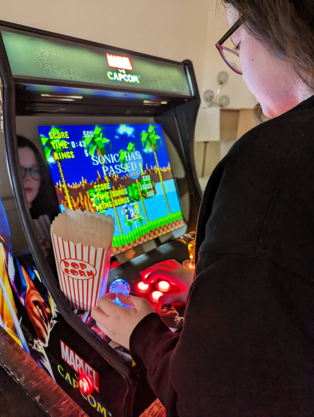 Guest playing a retro arcade game