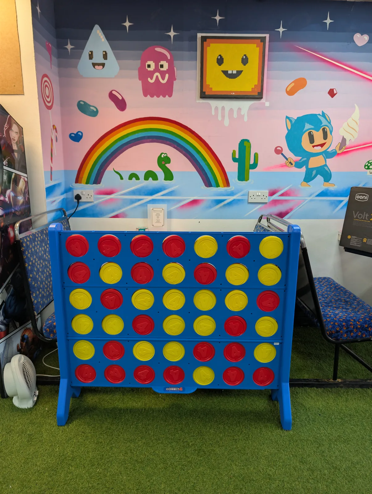 Large blue Connect 4 game set up inside Arcade Sweets