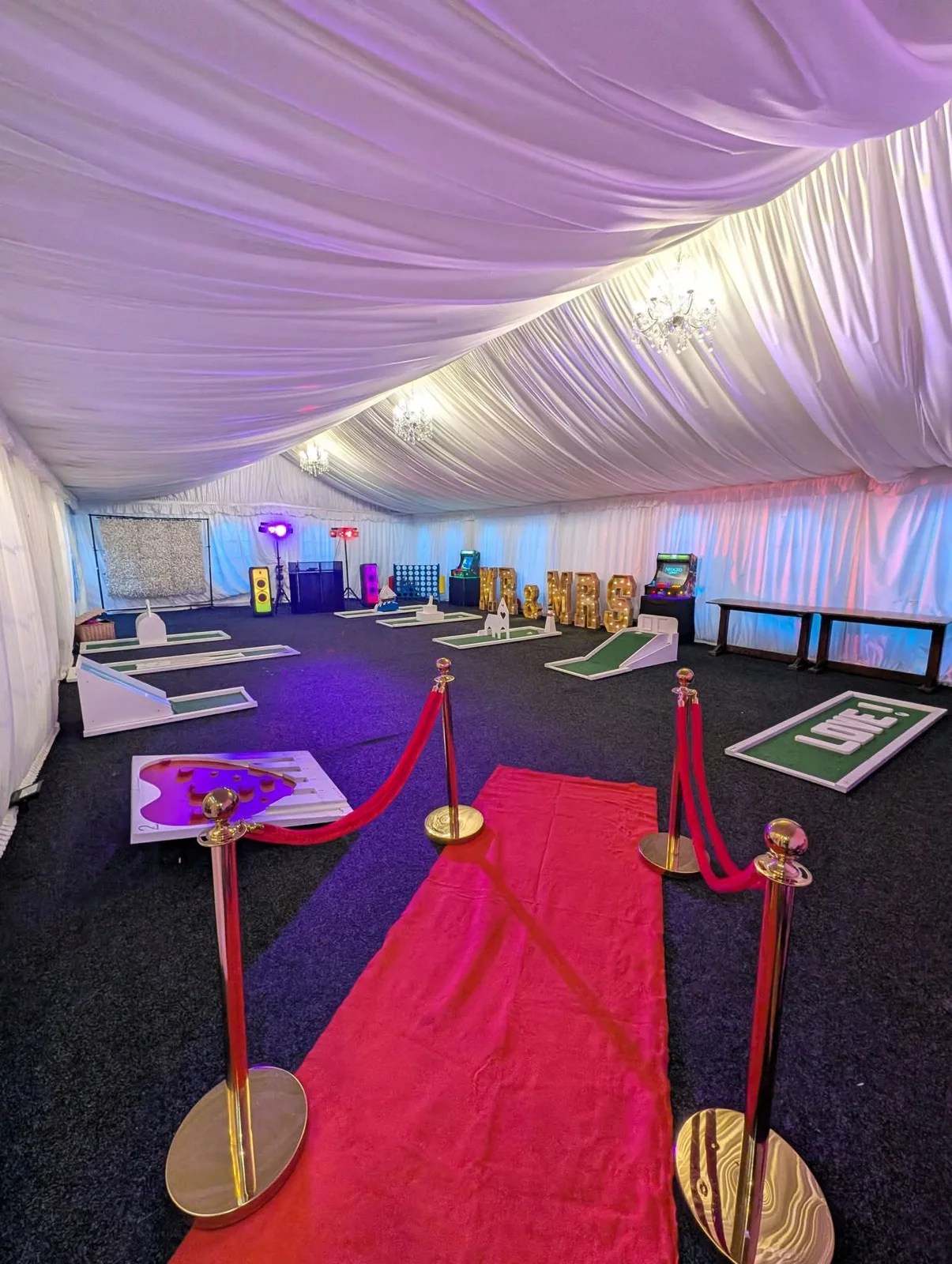 Mini golf and entertainment arranged in an event room