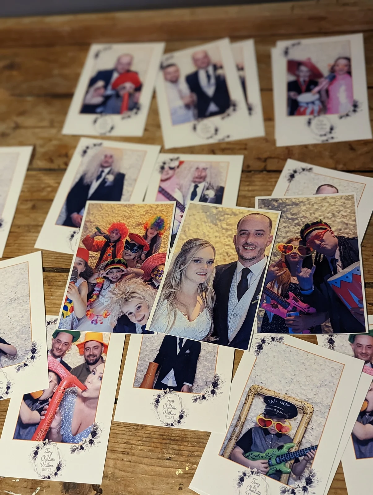 Finished wedding photobooth prints showing the couple and guests having fun