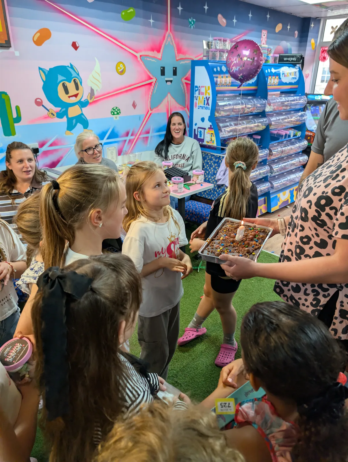 Birthday guests gathered together during a celebration at Arcade Sweets
