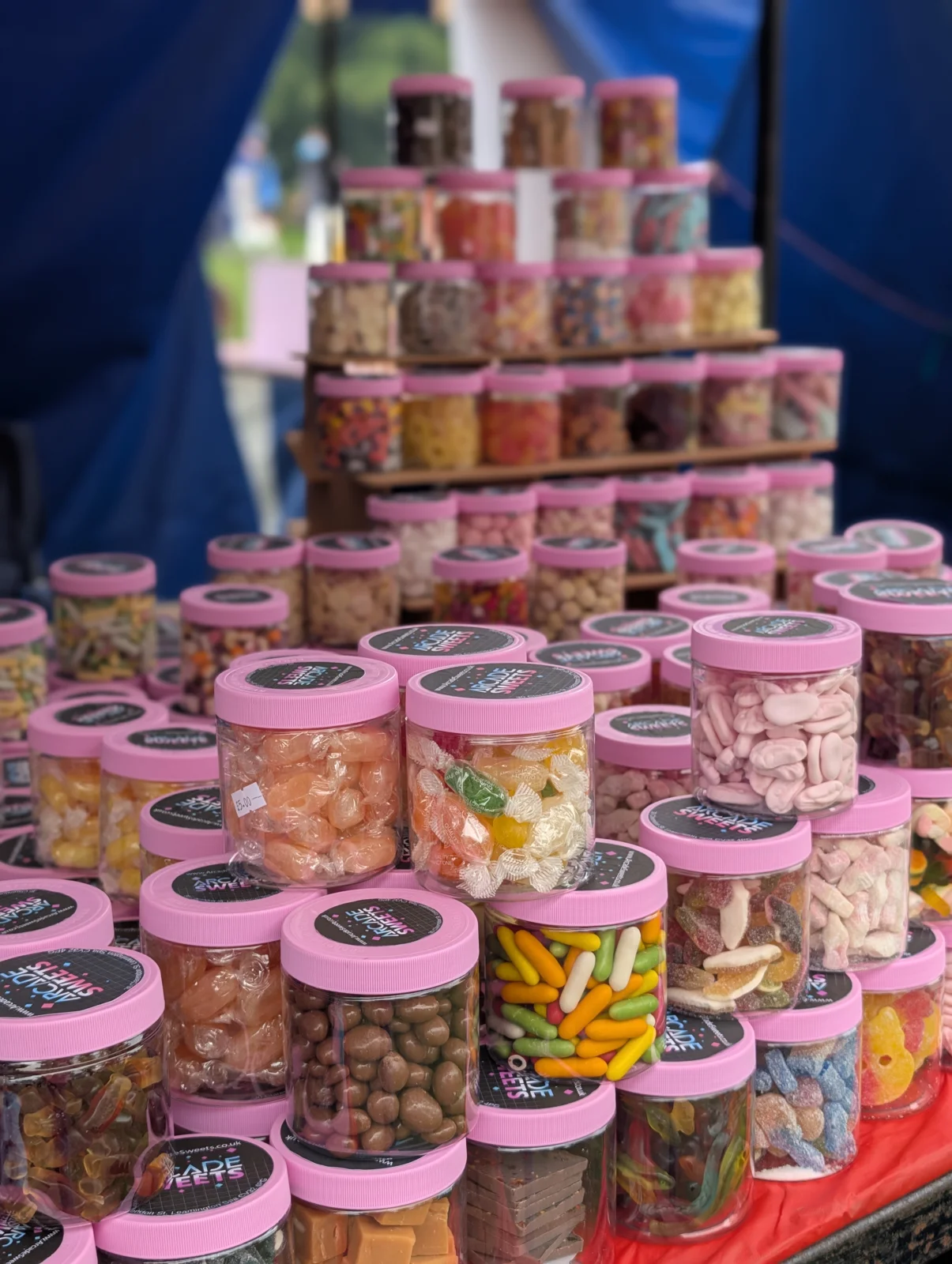 Colourful Arcade Sweets cups on display