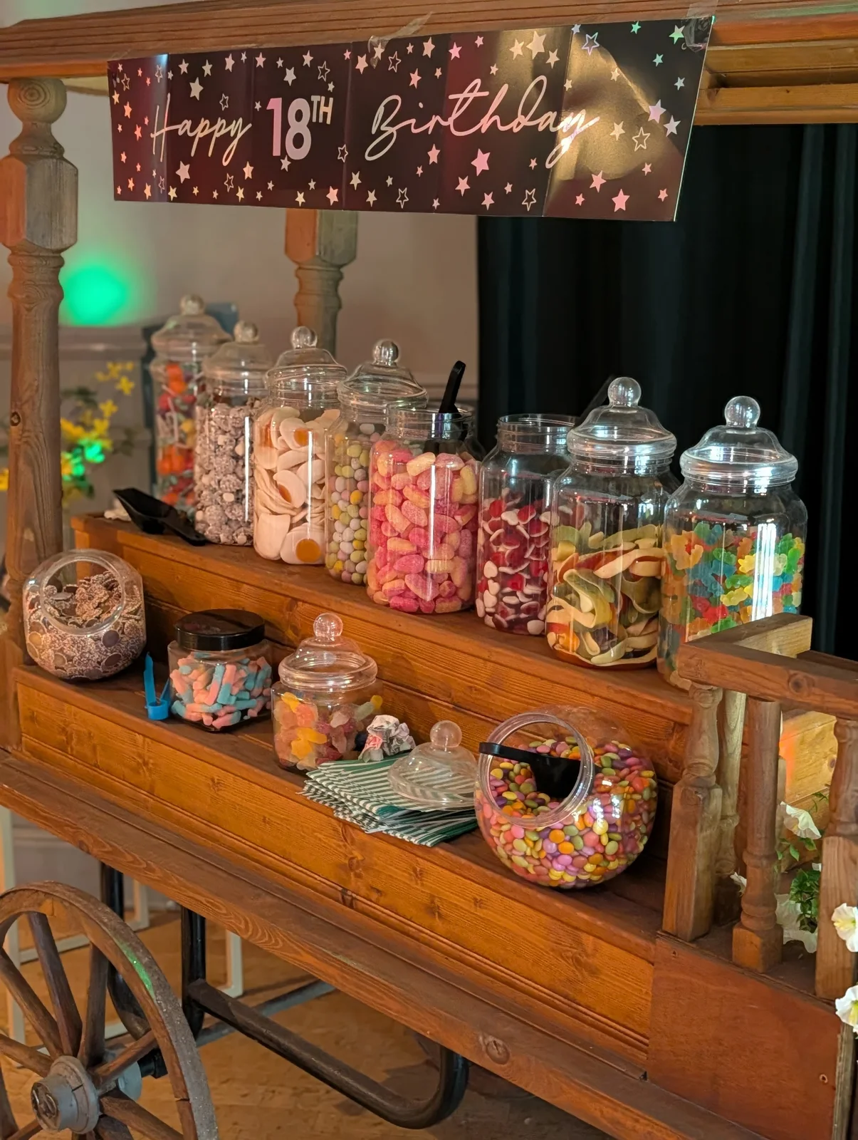 Stocked sweet cart at an eighteenth birthday celebration